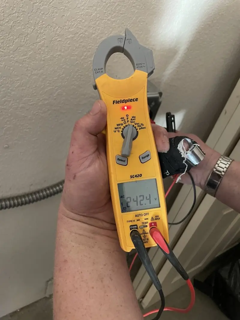 Voltage testing with clamp meter during Outlet Installation in Sweeny